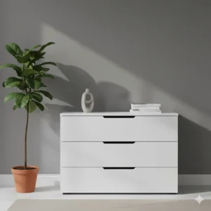 Sleek white modern chest of drawers with minimalist handles, positioned against a grey feature wall.