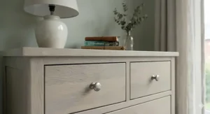 Close-up of the natural timber grain and brushed metal handles on a high-quality 8 drawer chest.