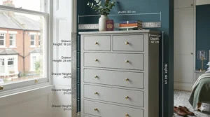 A dimensional diagram of a grey 8-drawer tallboy showing height, width, and depth measurements in centimetres for UK buyers.
