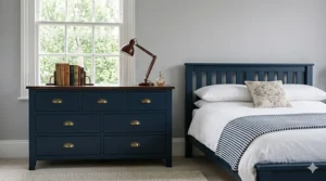 A Scandinavian-inspired bedroom suite with light timber finishes and tapered legs, styled with neutral British decor.
