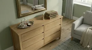A close-up of a tall chest of drawers securely anchored to a wall for child safety.