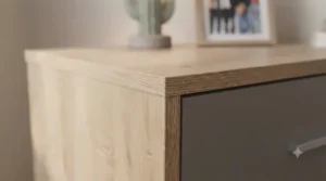 A compact, space-efficient chest of drawers placed in a smaller teenage bedroom to optimize floor space.