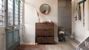 A functional deep-drawer hallway storage unit designed specifically to keep footwear and hallway clutter hidden away.