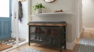 An industrial-style metal and timber hallway shoe storage bench with a comfortable seating top.