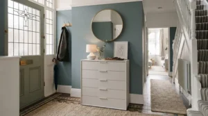 A modern, minimalist narrow chest of drawers with clean lines in a contemporary hallway.