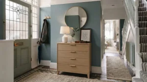 A light oak Scandinavian-style narrow chest of drawers perfect for a bright entryway.
