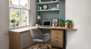 Corner desk and drawers combination utilising awkward dead space in a compact British bedroom layout.