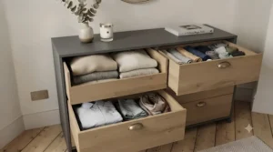 Open soft-close chest of drawers displaying deep, spacious storage for folded clothes and bedroom essentials.