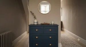Slimline LED lit chest of drawers fitted neatly into a British hallway to provide functional lighting and hallway storage.
