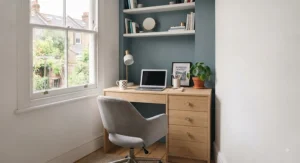 Light oak finish desk with integrated drawers, ideal for warming up a neutral colour palette in a small bedroom.
