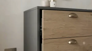 Detailed view of an oak finish soft-close chest of drawers highlighting the natural wood texture and quality craftsmanship.