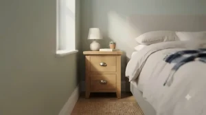 Narrow wooden 2 drawer nightstand positioned neatly in a tight space next to a double bed.